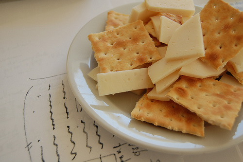 This is a photograph of a plate of cheese and crackers.