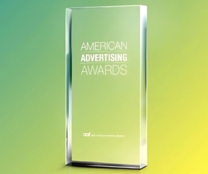 Clear Addy award with green and yellow background.