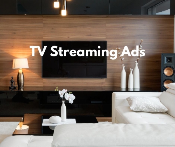 TV wood wall, and white couch advertises streaming ads.