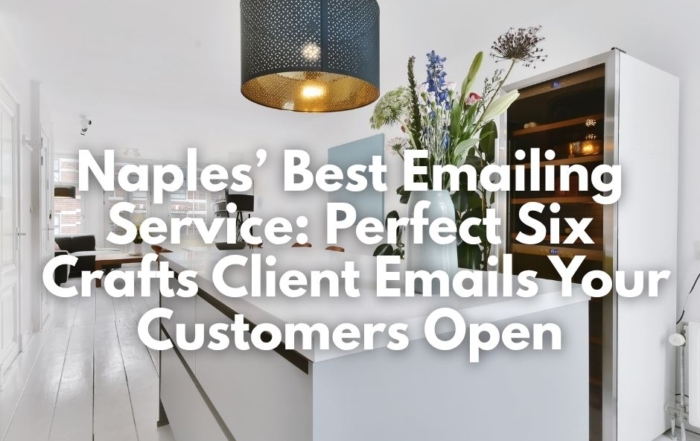 A white kitchen island and black pendant light.