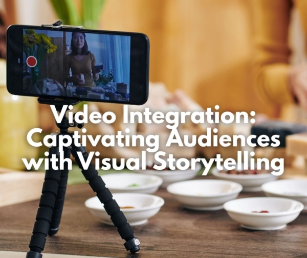 A woman taking video with dishes. Illustrates video integration on websites.